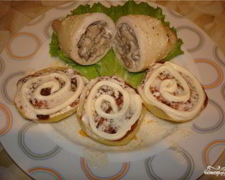 Кальмары, фаршированные рисом и грибами